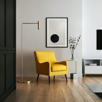 Photo by Kam Idris brown wooden framed yellow padded chair